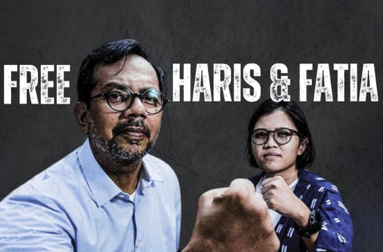 Haris Azhar und Fatia Maulidiyanti vor schwarzem Hintergrund